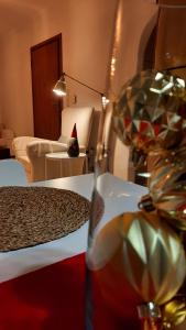 een glas wijn zittend op een tafel in een kamer bij Skyline Vista - Sea View Apartment with Free Parking in Piraeus