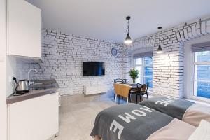 Televízia a/alebo spoločenská miestnosť v ubytovaní Homewell Apartments Wilson Park + 14 fotografií