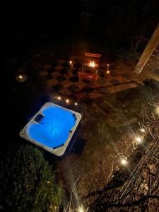 an aerial view of a swimming pool at night at Leura Haven Rustic Mountain Cottage in Leura