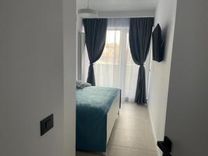 En eller flere senge i et værelse på Eleven Odyssey Apartment + 19 billeder