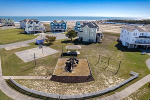 an aerial view of a playground with houses and the beach at CAC-17A - Sailfish in Buxton