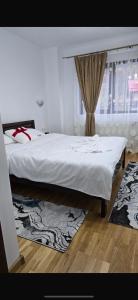 Ένα ή περισσότερα κρεβάτια σε δωμάτιο στο Pensiunea Rozalina