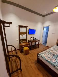 TV a/nebo společenská místnost v ubytování Astoria Cottage