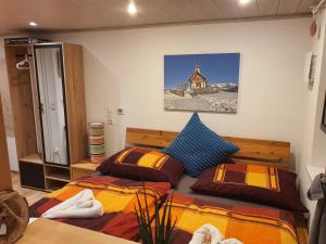 a bedroom with two beds and a church at Apartment Altenhof in Altenhof