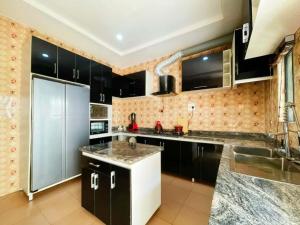 Køkken eller tekøkken på Phienu Apartment & Suite