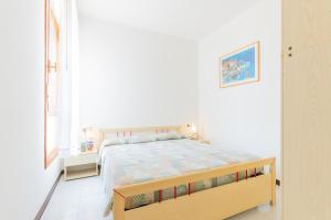 En eller flere senge i et værelse på Residence Le Zattere + 139 billeder