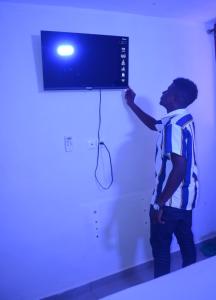 Televisyen dan/atau pusat hiburan di Appartements meublés GNB