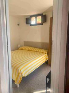 En eller flere senge i et værelse på Casa Elicriso