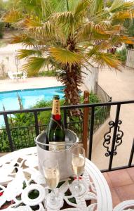 a bottle of champagne in a bucket on a table at Lakehouse Bed and Breakfast in Canyon Lake