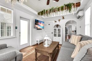 a living room with a couch and a table at La Barra #101 in St. Pete Beach