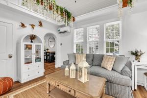 a living room with a couch and a table at La Barra #101 in St. Pete Beach
