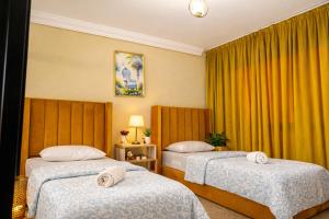 Ένα ή περισσότερα κρεβάτια σε δωμάτιο στο Experience Comfort in a Modern Apartment