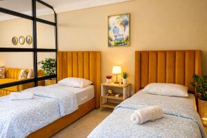 Ένα ή περισσότερα κρεβάτια σε δωμάτιο στο Experience Comfort in a Modern Apartment