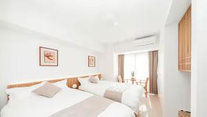 Postel nebo postele na pokoji v ubytování 天空Sky Hotel + 34 fotografií