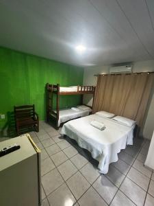 Postel nebo postele na pokoji v ubytování Pipa Hotel Pe na Areia