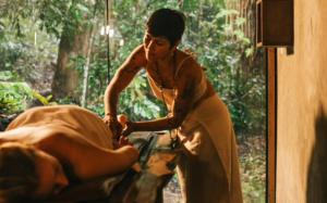 a woman standing next to a man laying down at Bangalôs Suítes na Floresta Encantada in Santarém