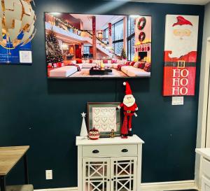 a room with a santa claus picture on the wall at Fancy Studio Private Entrance in Selden