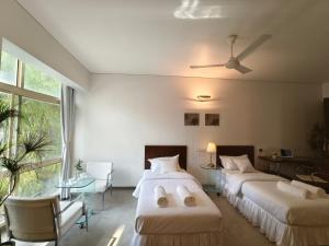 Postel nebo postele na pokoji v ubytování Urban Opulence