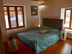 En eller flere senge i et værelse på Clos Leonard