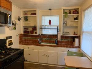 a kitchen with a sink and a counter top at Cozy Home close to Downtown in San Antonio
