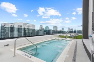 a hot tub on the roof of a building at Downtown Miami - Rooftop Pool & Gym in Miami