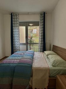 Giường trong phòng chung tại Dilman appartamento +24 ảnh