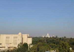 a view of a building with a city in the background at The Street Homestay-600m from Taj Mahal in Agra