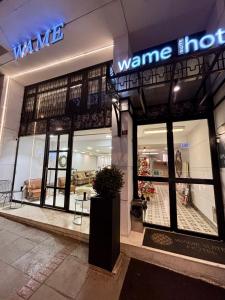 a wimme home store with a sign on the facade at Wame Suite Hotel Nisantasi in Istanbul