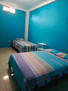 Postel nebo postele na pokoji v ubytování Hospedaje Piquero