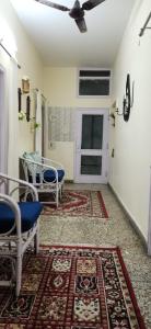 a room with a table and chairs and a door at The Moonvale Cottage A Victorian Theme Independent Homestay! in Chandīgarh