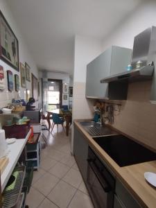 a kitchen with a sink and a stove top oven at Alice in Wonderland in Sutri +34 photos