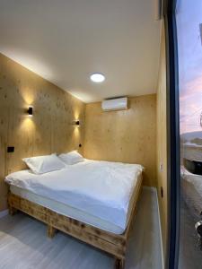 Giường trong phòng chung tại Пан0рама