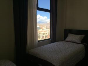 Ένα ή περισσότερα κρεβάτια σε δωμάτιο στο Residencial Alta Vista