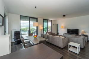 a living room with a couch and a table at White Cloud Apartments in Korčula