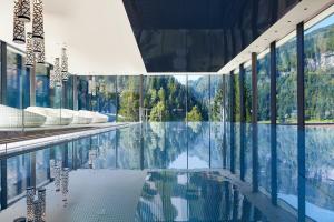 The swimming pool at or close to Alpin Life Resort Lürzerhof