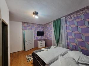 Postel nebo postele na pokoji v ubytování Casa Bunicilor