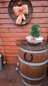 a mirror on a barrel with two teddy bears on it at La Cabane du Trappeur in La Bourgonce +27 photos