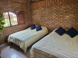 Postel nebo postele na pokoji v ubytování Playas Lodge