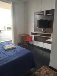 TV a/nebo společenská místnost v ubytování Hotel Roma Edeia