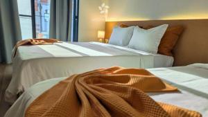 Postel nebo postele na pokoji v ubytování Casa Jardim di Sol