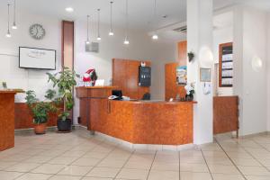 a lobby of a store with a reception counter at Trip Inn Hotel Minerva Frankfurt in Frankfurt/Main