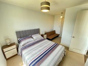 Giường trong phòng chung tại Departamento Dos Ambientes