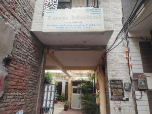 an entrance to a brick building with a sign on it at Hotel O Tara Mahal in Jaipur