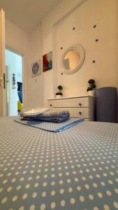 a bedroom with a bed with a checkerboard at Fay's paradise in Polychrono +39 photos