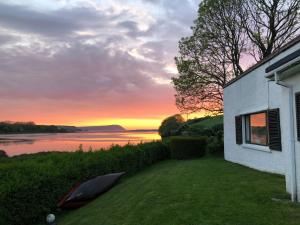 a view of a sunset from a house at Bryncyn in Newport