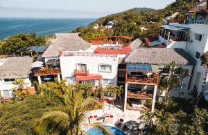 an aerial view of a resort with the ocean at Pájaro de Fuego 406 in Sayulita