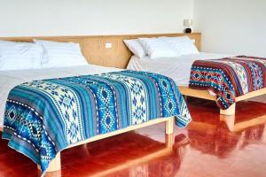 Ένα ή περισσότερα κρεβάτια σε δωμάτιο στο Ncielo Adventure Lodge