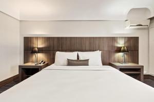 Postel nebo postele na pokoji v ubytování Slaviero Curitiba Centro + 105 fotografií