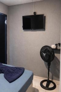 Et tv og/eller underholdning på Peró Beach Hospedaria