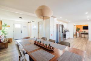 a kitchen and dining room with a table and chairs at Wanderlust- Desert Escape Stargazing Fire Pit in Twentynine Palms